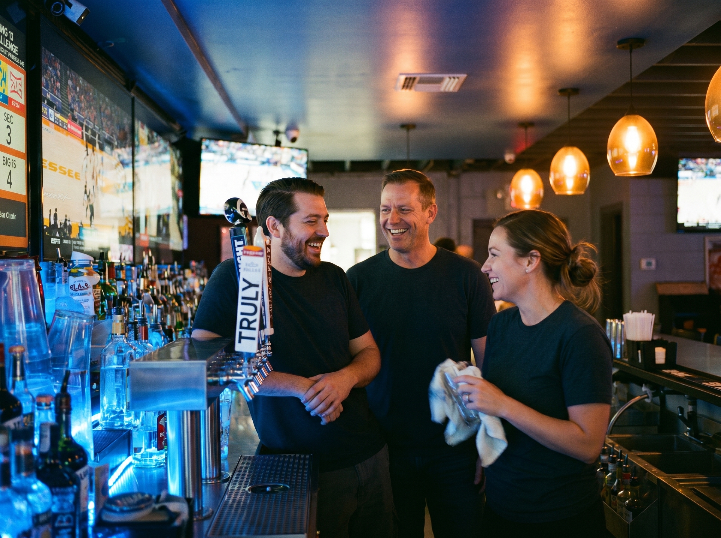 Bartenders behind the bar at The Blue Moon Lounge